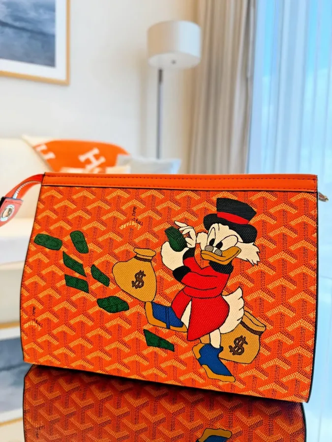 Strooge McDuck with Goyardine Senat MM Clutch Bag