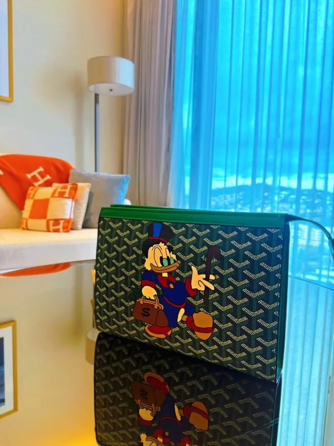Strooge McDuck with Goyardine Senat MM Clutch Bag
